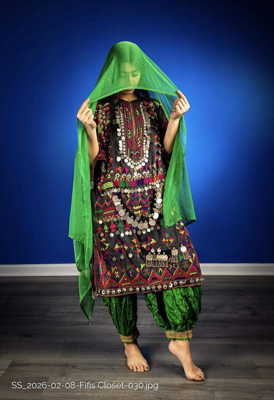 Traditional Afghan dress with green dupatta and silver coins